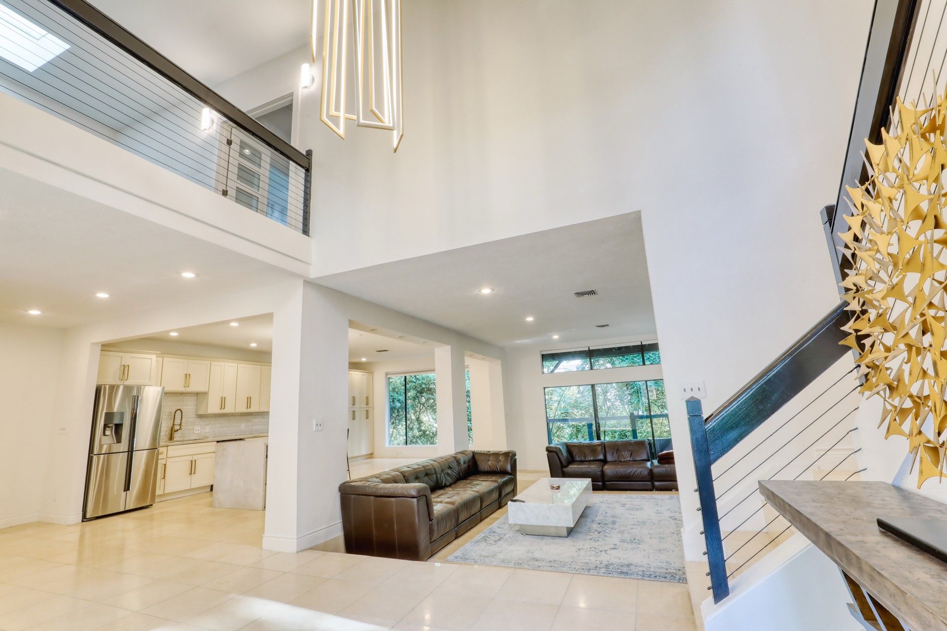 Two-story living room with open loft and kitchen